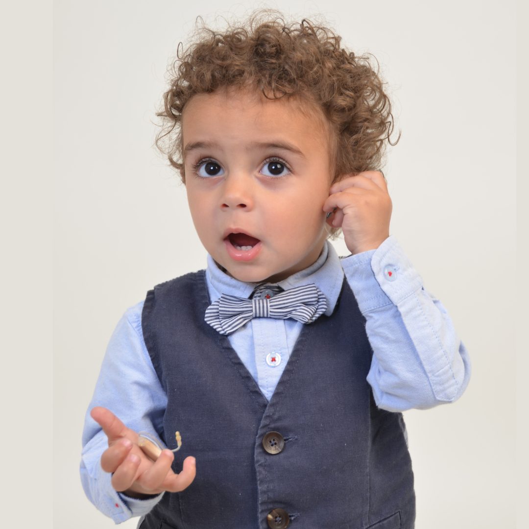 child with hearing aid